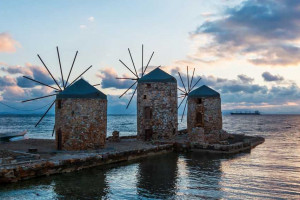Four mills by the sea at sunset on ​​the island of Chios